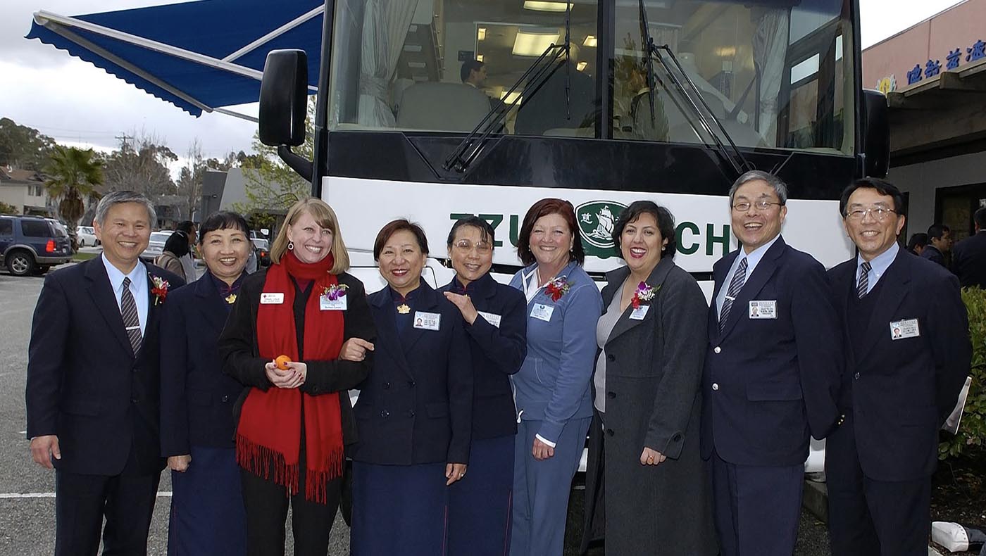 Volunteers and guests gather for a photo on February 24, 2008, during the inauguration ceremony for the first Tzu Chi Mobile Clinic to serve in Northern California.