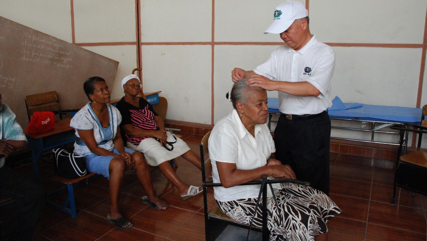On July 19, 2014, Mike Liaw provided acupuncture treatment to local patients at a free clinic in Haiti.