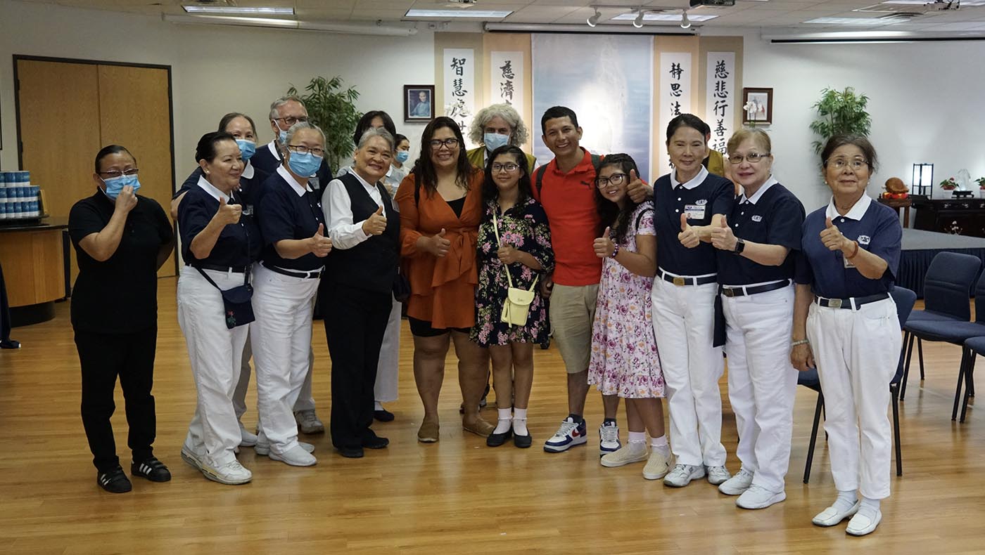 José López, his wife Jenny, and their daughters Maily and Emily take a photo with the Tzu Chi Las Vegas team after Jenny and the girls receive much-needed glasses from the new Vision Mobile Clinic.