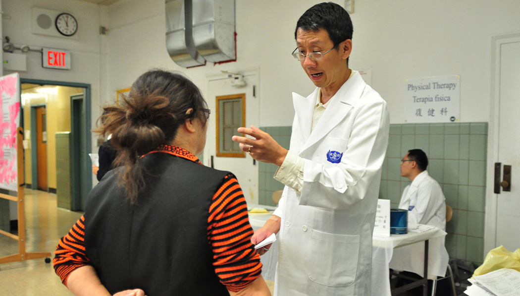 Joe Chang talking to the patient