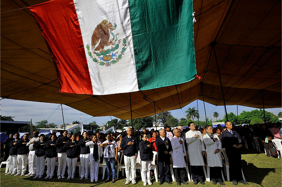 Tzu Chi international medical outreach team under a Mexican flag