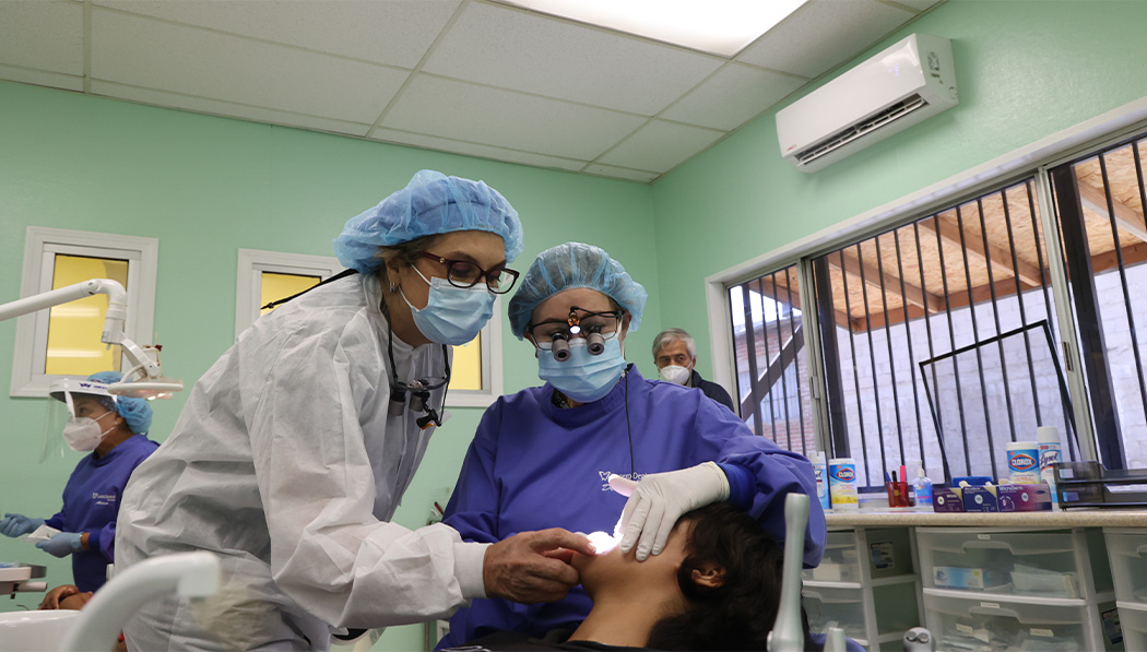 Teresa giving patient dental treatment