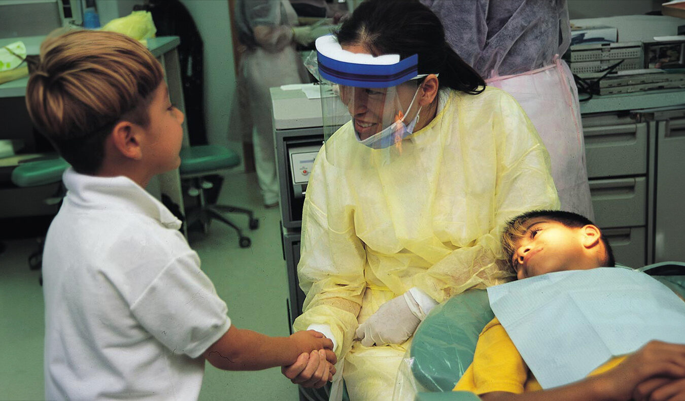 A Tzu Chi International Medical Association (TIMA) doctor interacts with her young patients