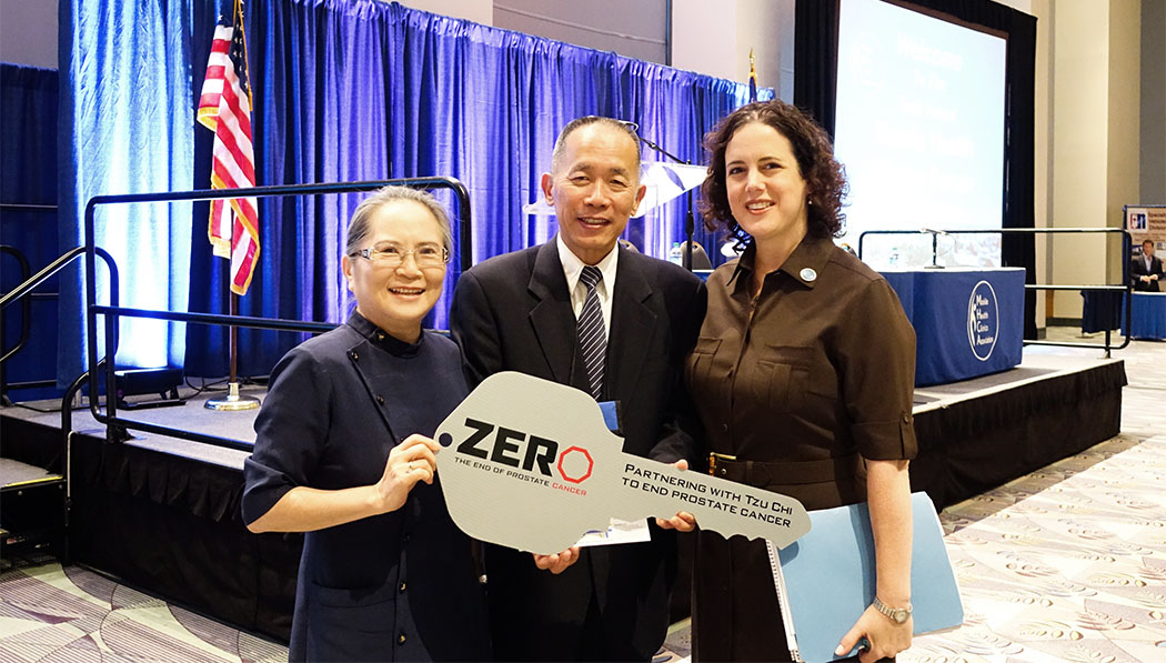 William Keh (middle) and his wife Mary Keh (left) receive a key symbolizing the donation of the Mobile Clinic to Tzu Chi from ZERO Prostate Cancer board member Elizabeth Wallace (right) in 2014