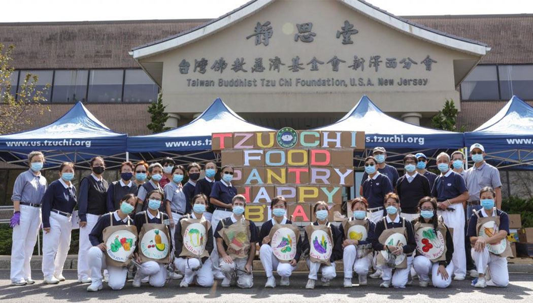 Donning their PPE, volunteers in Cedar Grove, New Jersey, pose for a photo to mark 10 years of food pantry services at the Mid-Atlantic Region Office.