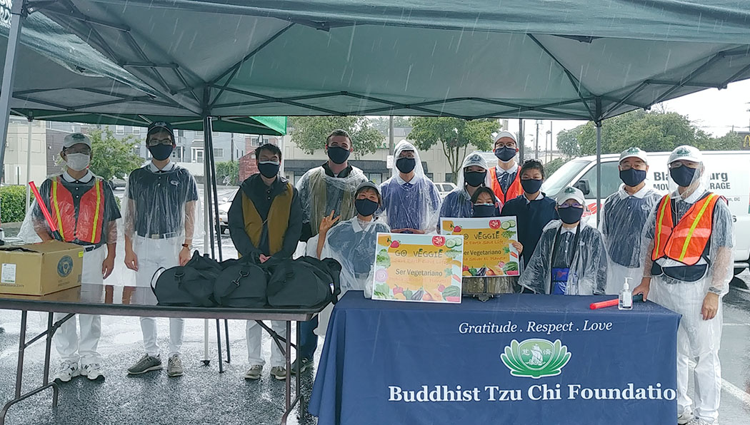 In August 2020, despite the downpour, Greater Washington DC volunteers host a grocery distribution at the East River Family Strengthening Collaborative.