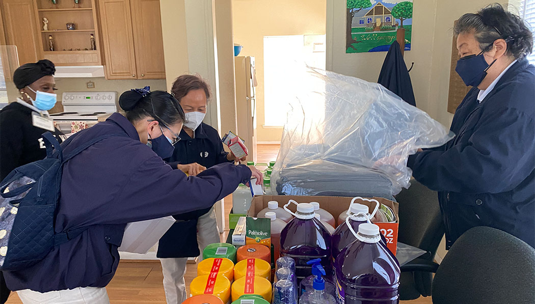 In February 2022, Southern Region volunteers in Houston, Texas, deliver blankets, disinfectant, and cleaning supplies to Wellsprings Village, a shelter for women experiencing domestic violence and/or homelessness.