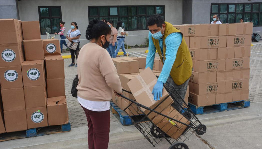 Food distributions, which had long served low-income families in Wilmington, California, also resume outside the Torrance Service Center in March 2021.