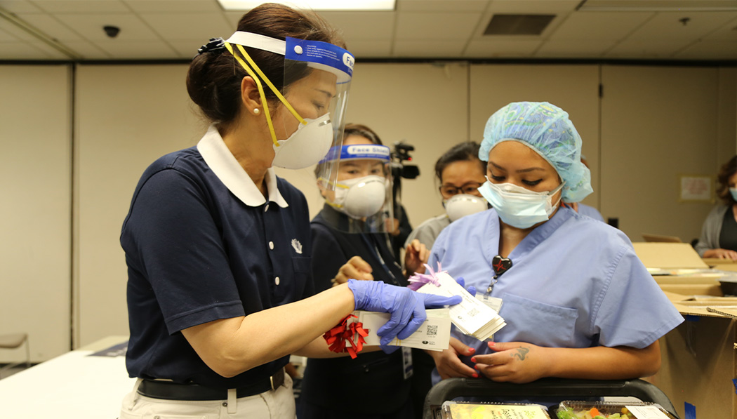 Learning about the meaning behind the meals, Riverside University Health System staff take Tzu Chi volunteers’ efforts to heart.