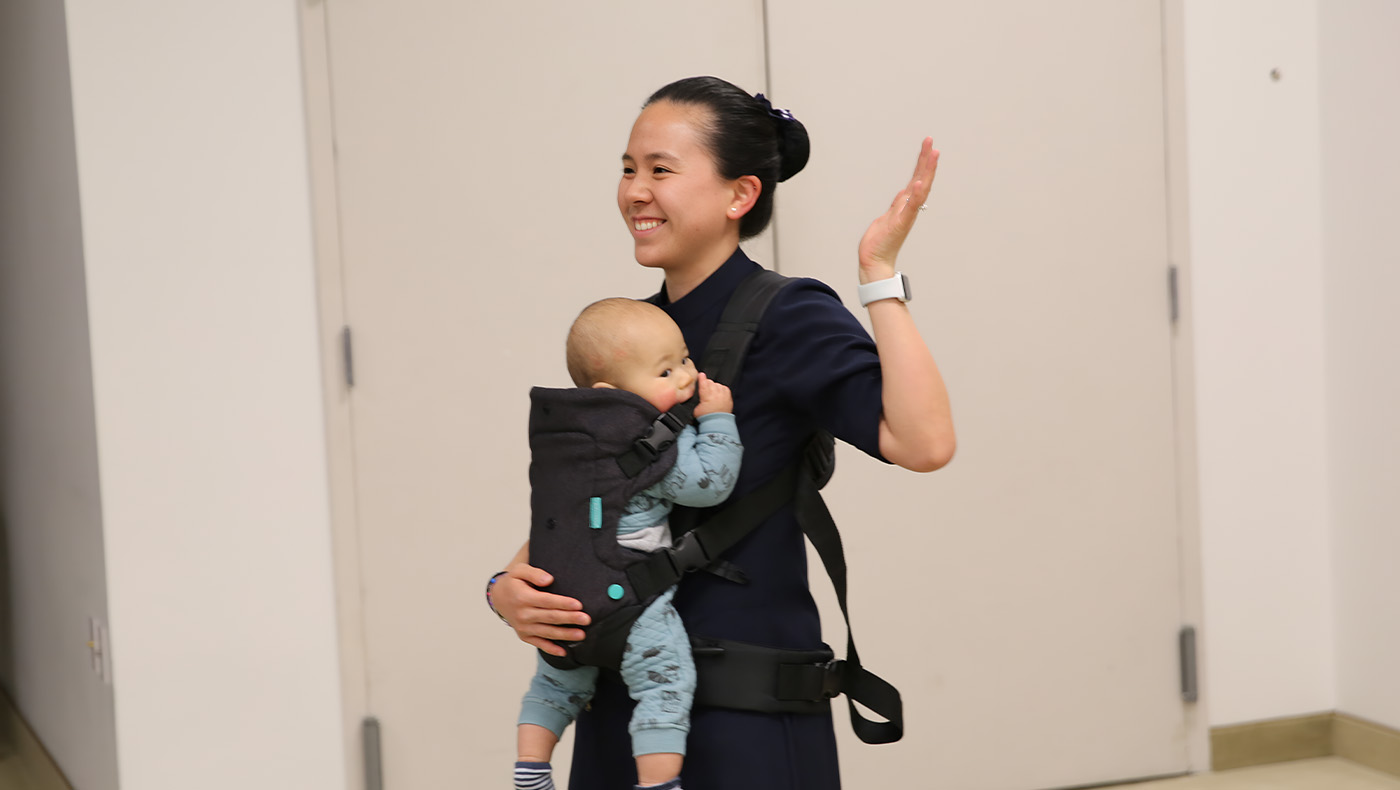 Carol Wu, a volunteer who grew up in New Jersey, returns from Boston with her child for the 30th anniversary celebration