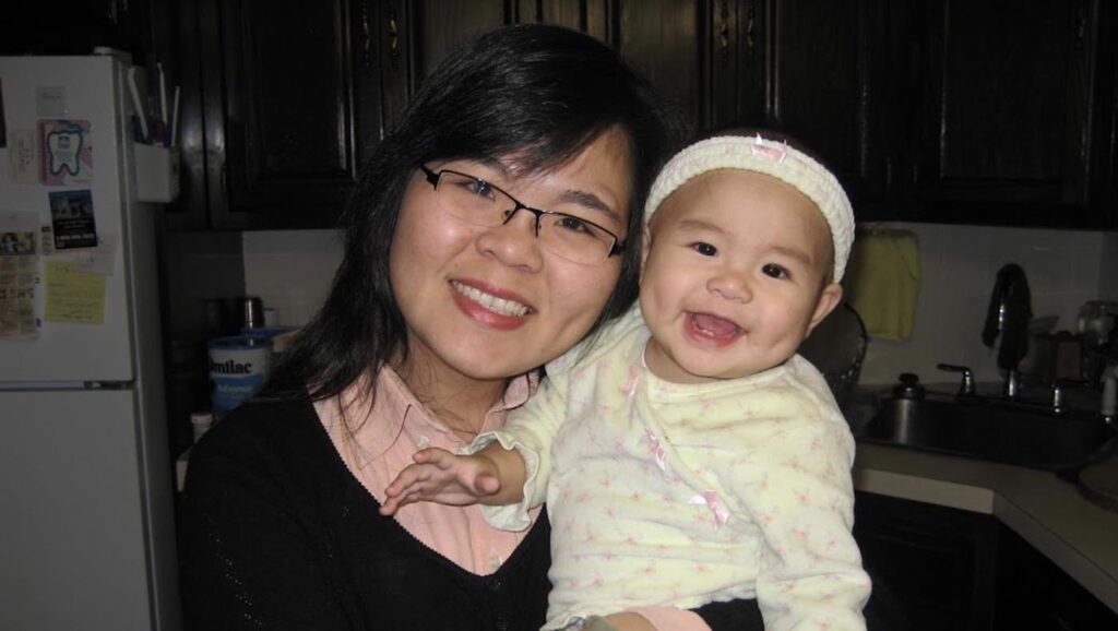 IJung Lin holds Chloe Chen as a baby