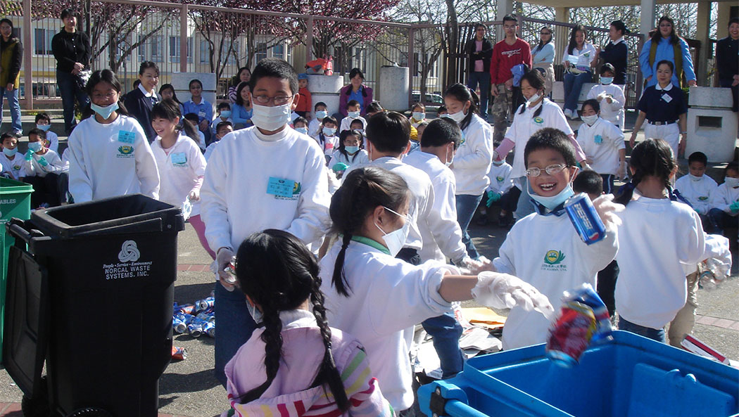 students at Tzu Chi Academy, San Francisco, sort recyclable materials.