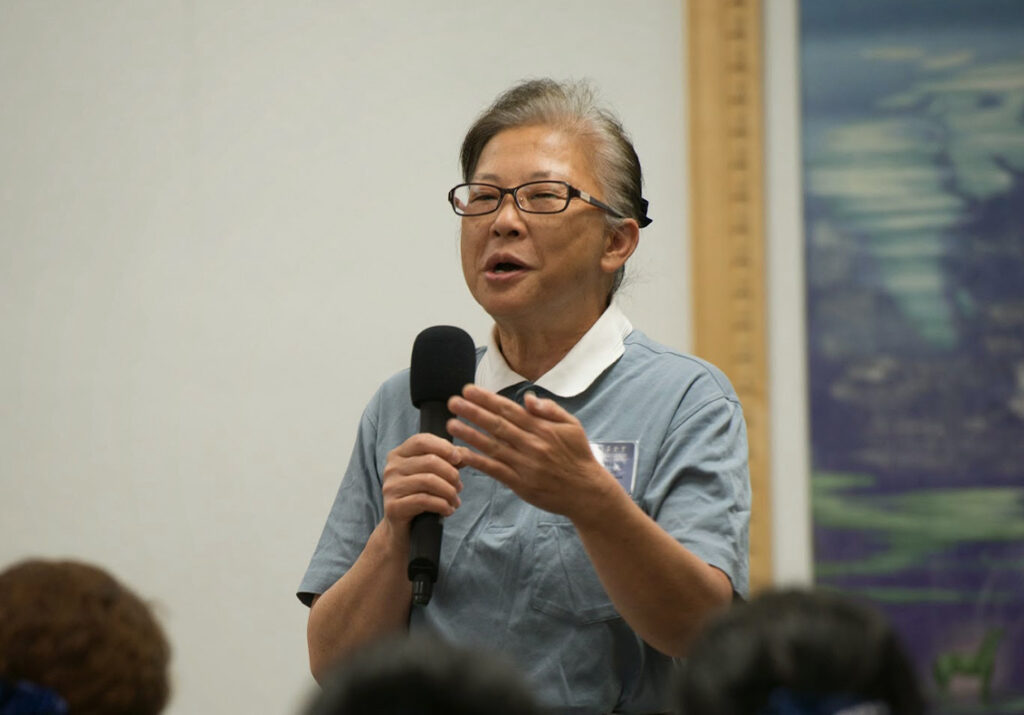 Tzu Chi volunteer Mingling Hsieh giving a speech