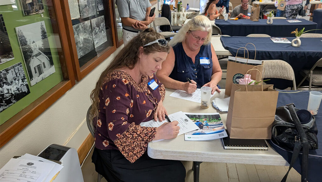 some participants complete registration forms