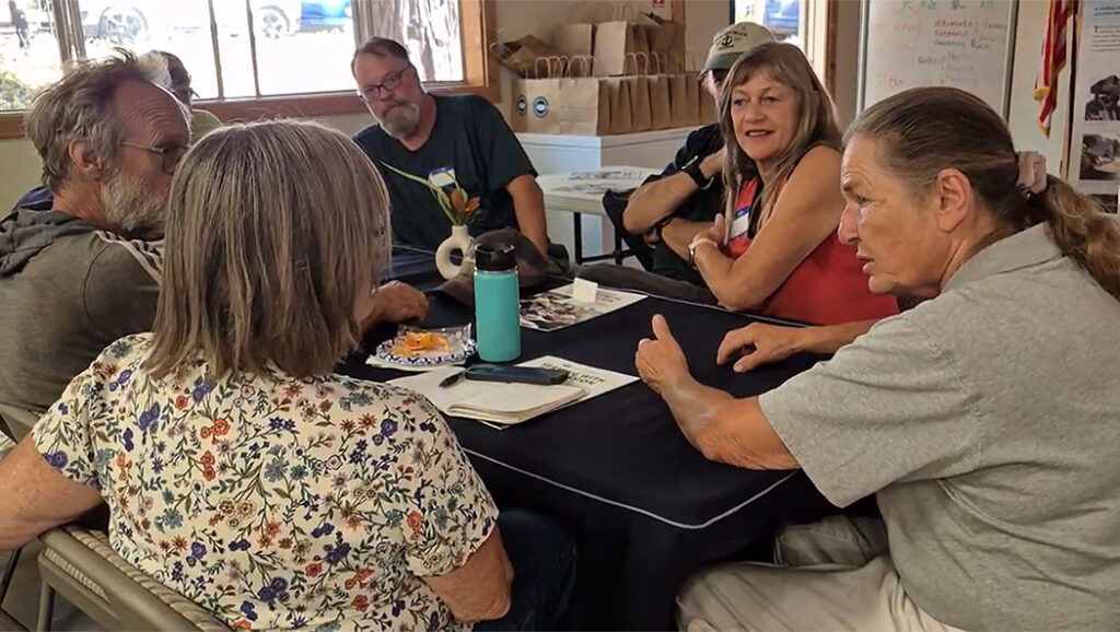 Julie Bos (right), a disaster case manager at the Tzu Chi Chico Recovery Center, shares her insights on volunteering during the Connection and Coalition for Recovery volunteer orientation event.