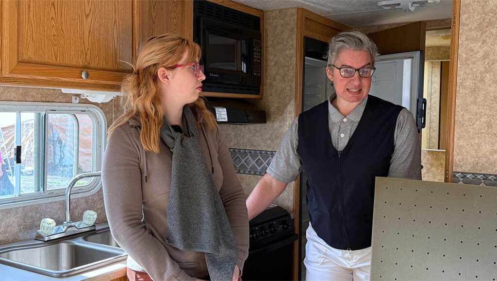 Havyn Morris listens as Bobbie Rae Jones outlines a plan for securing the essential equipment and household basics Havyn still needs