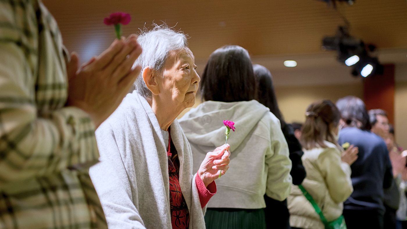 Amid soft lighting and fresh flowers, peace fills attendees' hearts as prayers are offered for the future. Photo/C.M. Yung